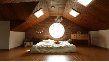 Attic bedroom with skylights.