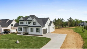 Large white two-story home.