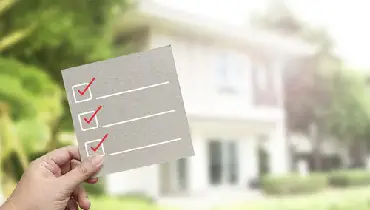 Hand holding inspection pass.